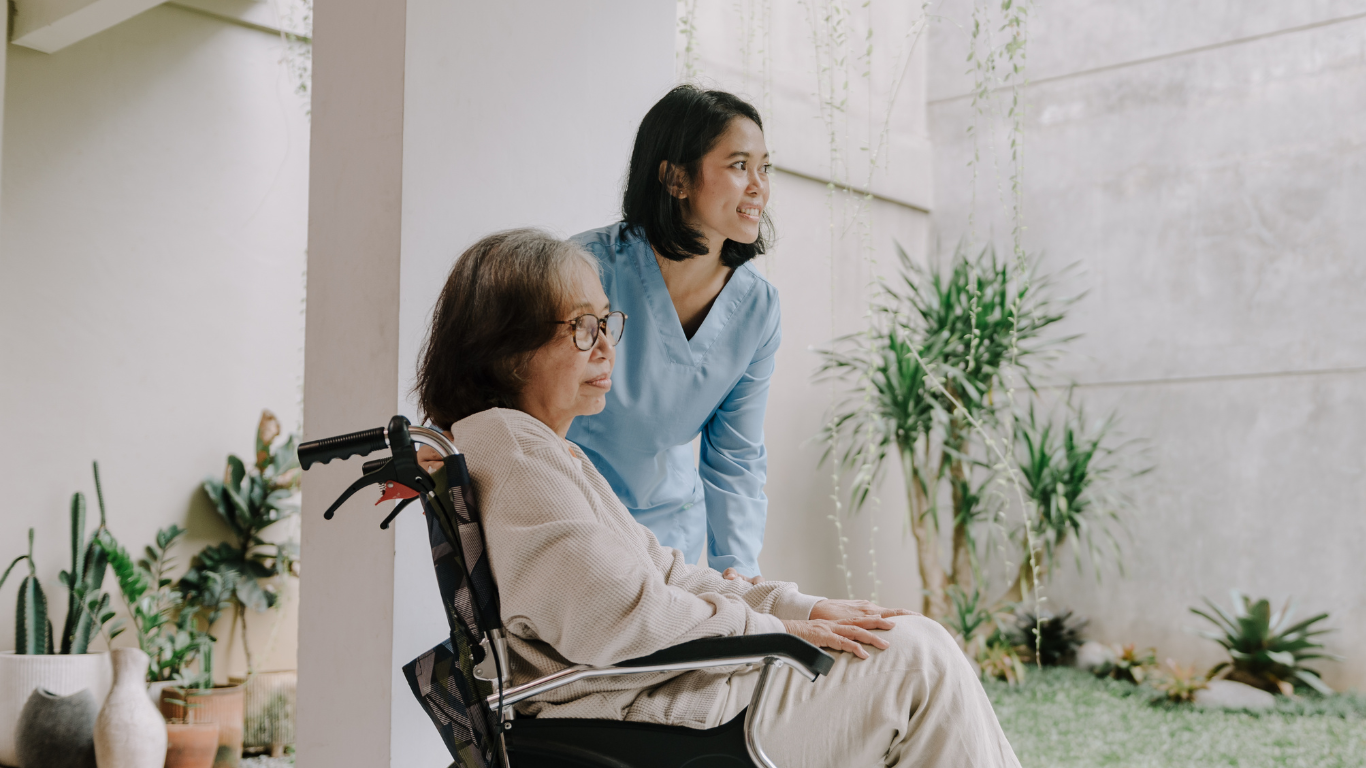 nurse applying wound dressing during in-home visit